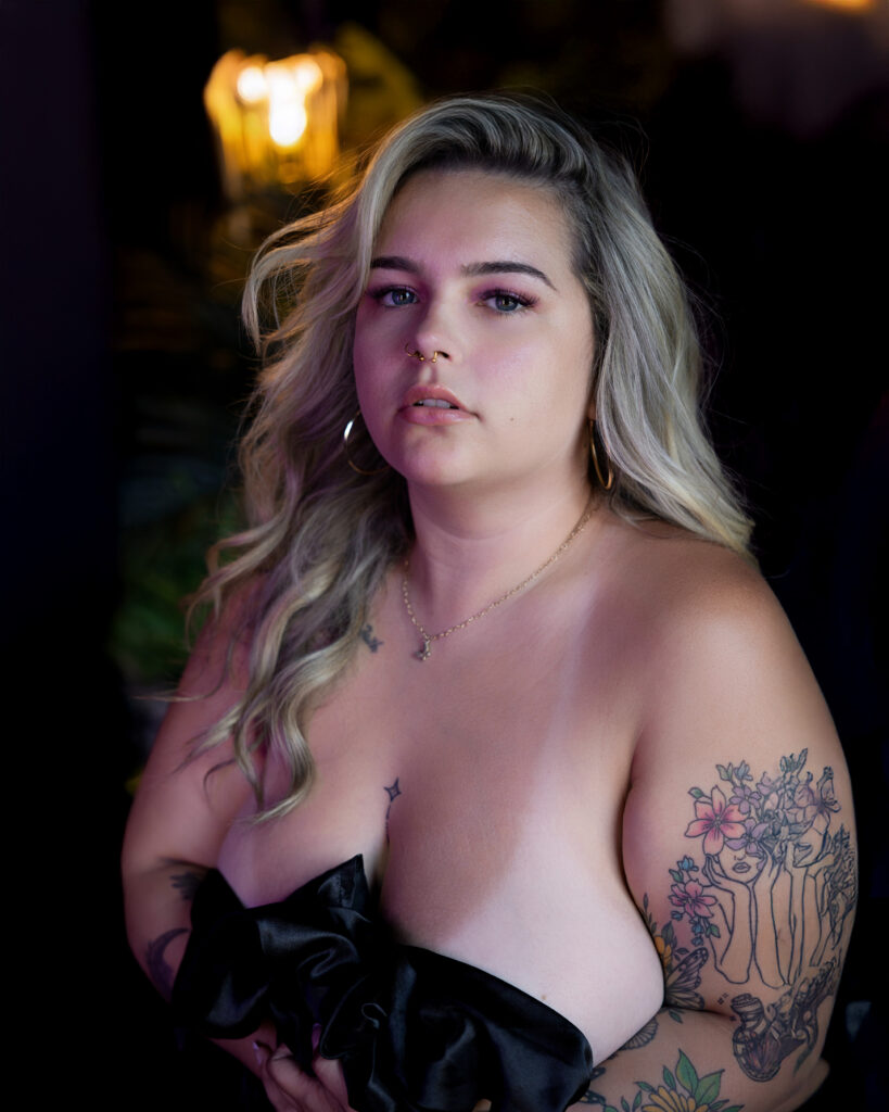 Woman holding a black sheet