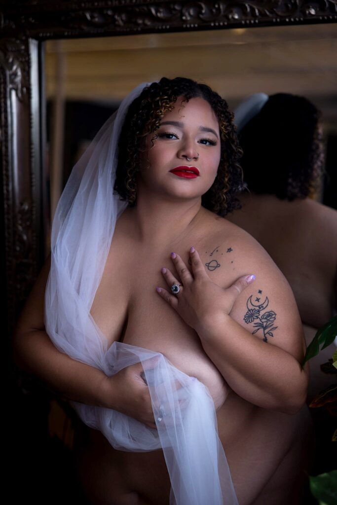 Plus size bridal boudoir photography showing curvy bride in stunning pose