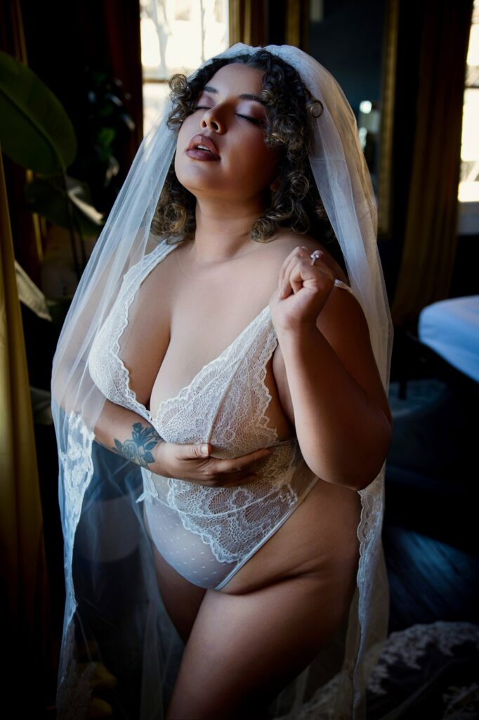 Bride posing in white lingerie