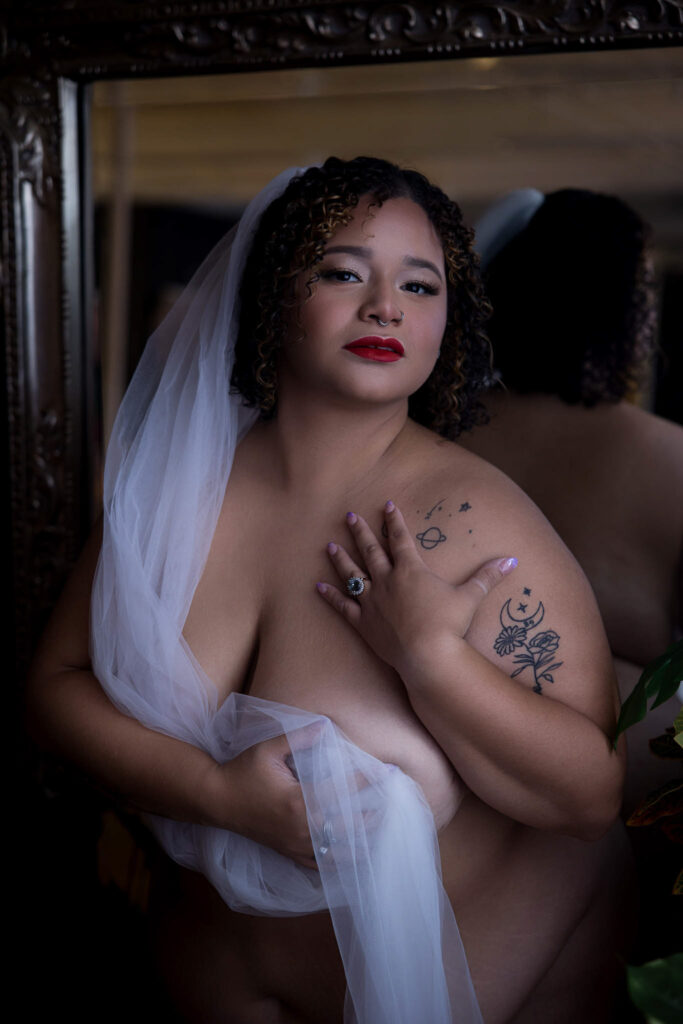 Plus size woman in a bridal boudoir session