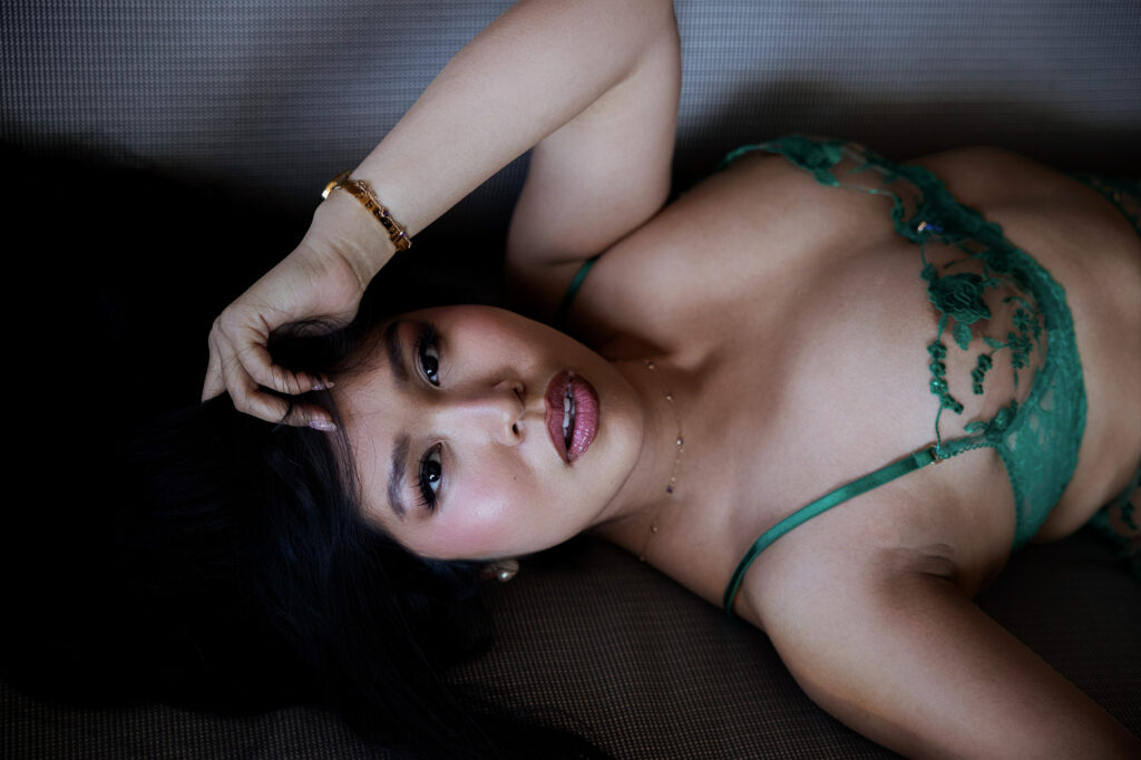 Woman in a boudoir session with green lingerie